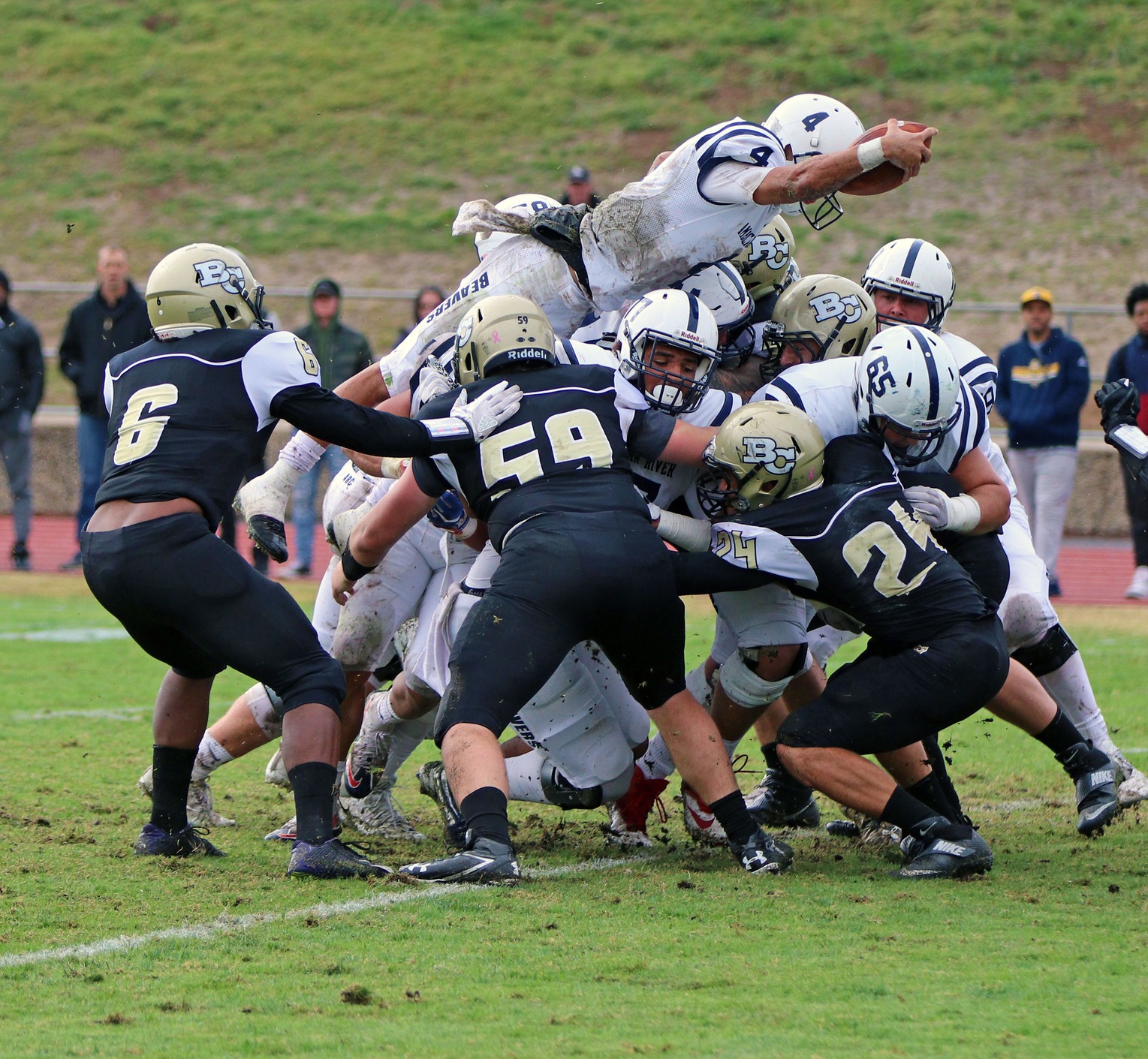 Picture of the team in action. QB is diving for the touch down.